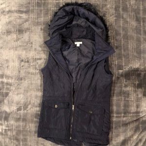 deep purple colored vest with fur around hood